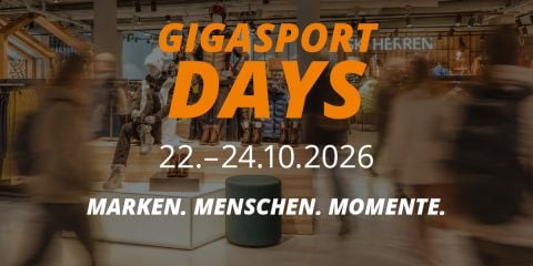 Werbegrafik für die Gigasport Days vom 22. bis 24. Oktober 2026 mit dem Slogan „Marken. Menschen. Momente.“ in einer Ladenumgebung.